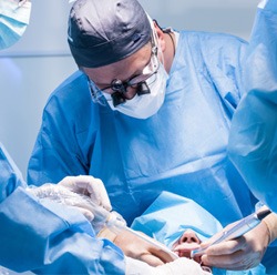 Dentists performing surgery to place dental implants