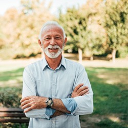 Dental patient in chair looking to side and smiling