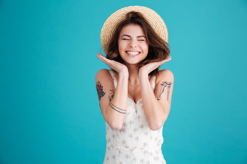 Cheerful smiling woman in straw hat